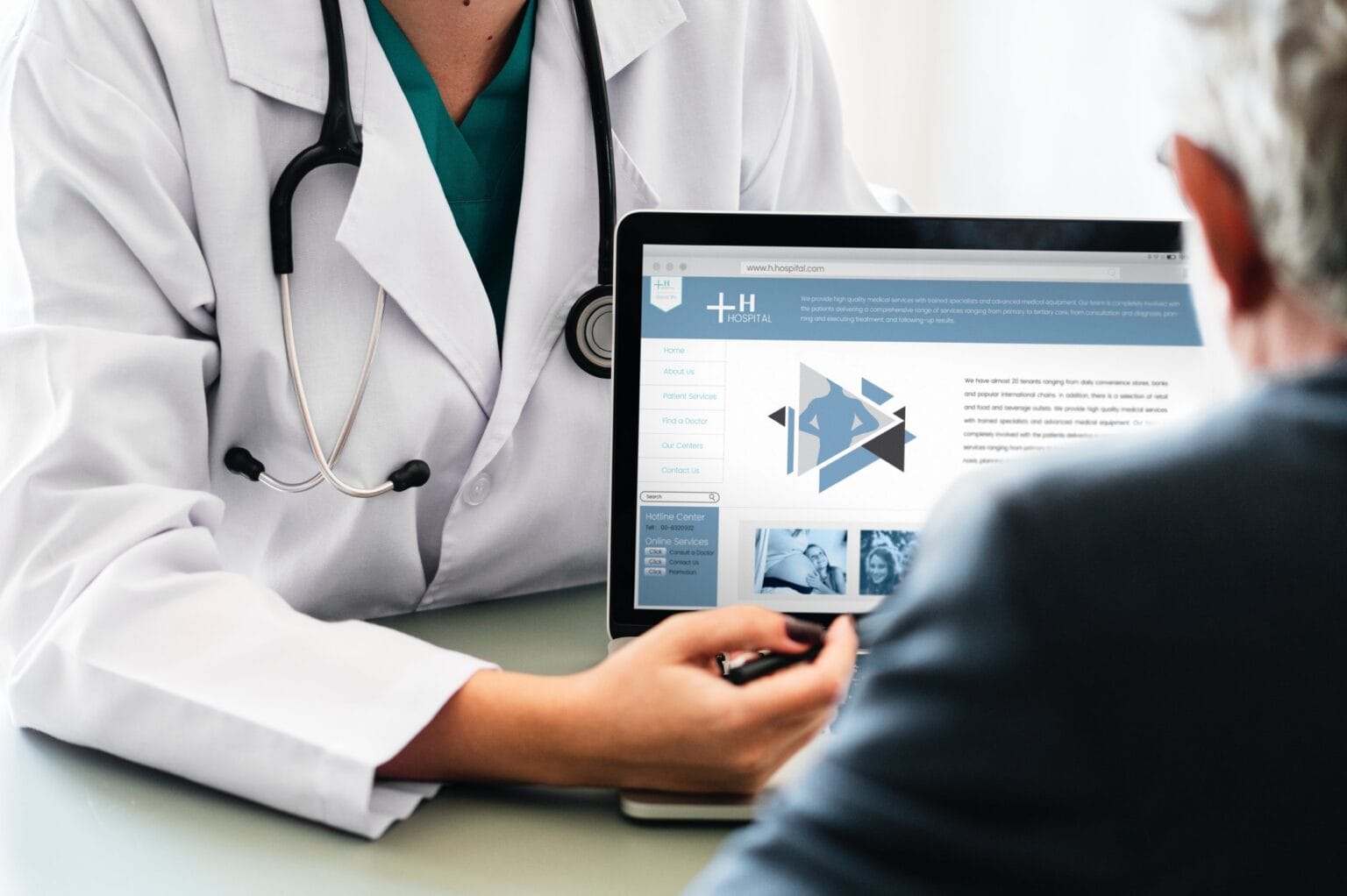 A physician showing data on a computer screen